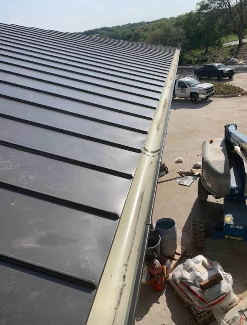 Standing seam panel and gutter detail on a metal roofing jobsite in Marysville